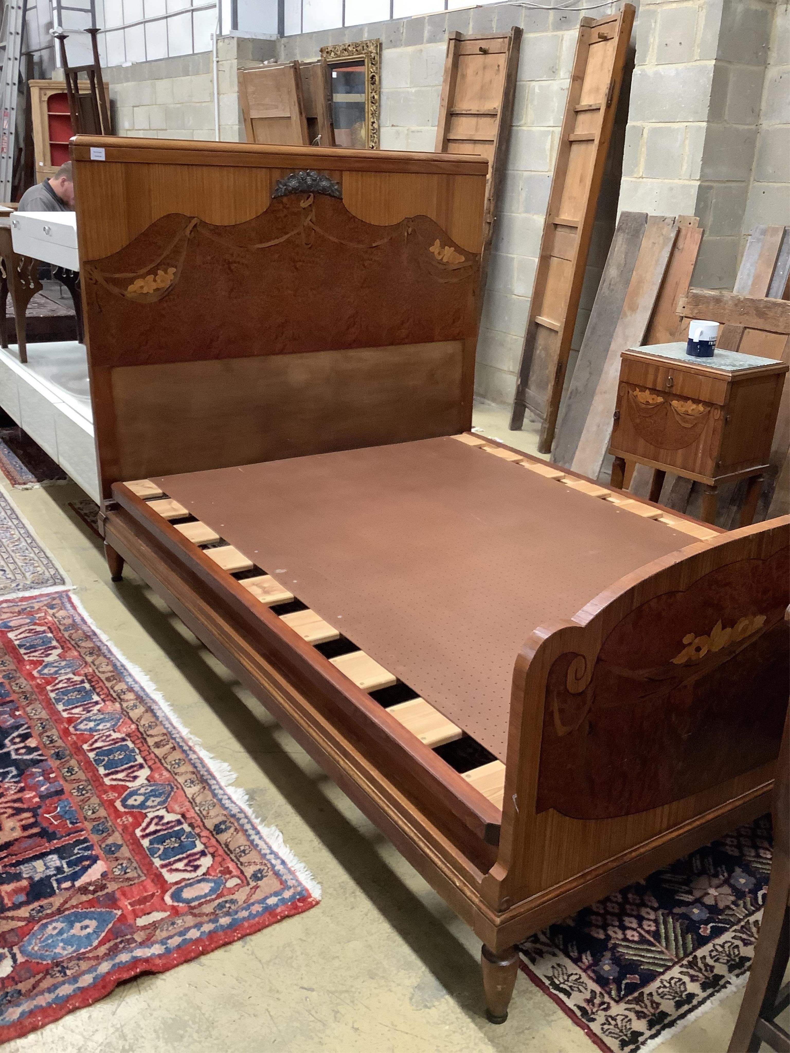 A French Art Deco walnut, amboyna and marquetry kingsize bed and a matching bedside cupboard, width 150cm, length 208cm, height 140cm. Condition - fair to good